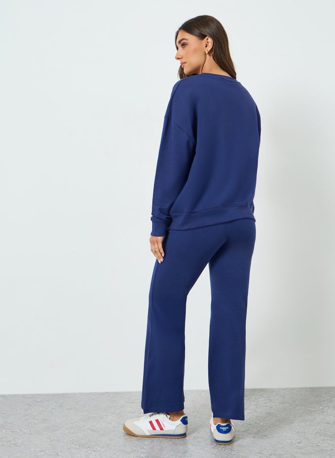 ستايلي طقم منسق من بنطال بأرجل واسعة وسويت شيرت بطبعة جرافيك - Image 3